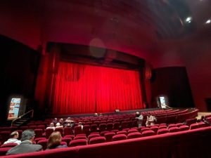 Theatre showing red velvet grand drape in situ.